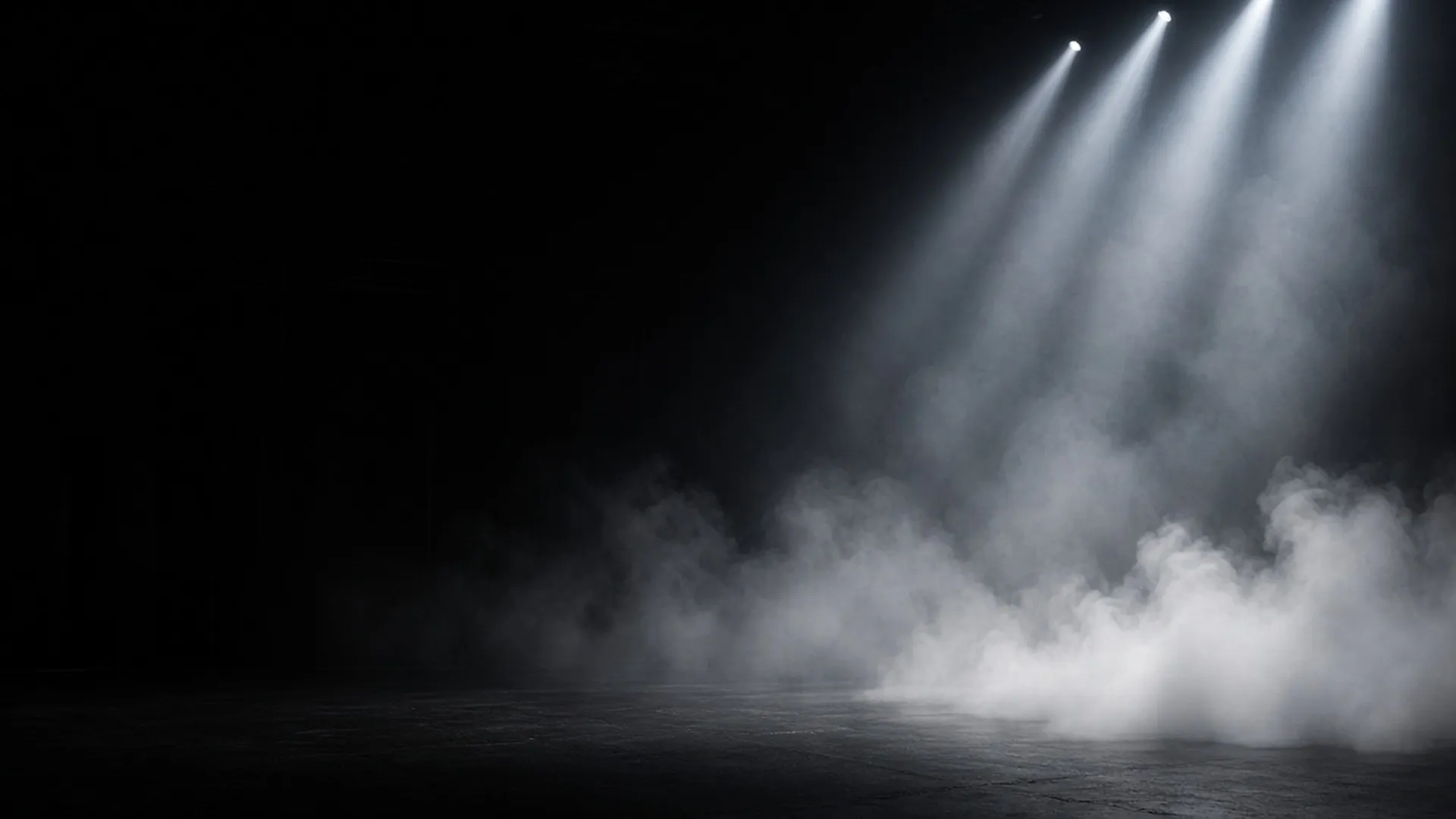 Split scene: dense white fog on the left of a stage