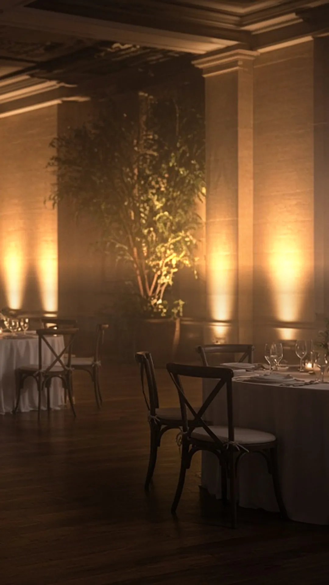 An empty wedding reception hall at dusk